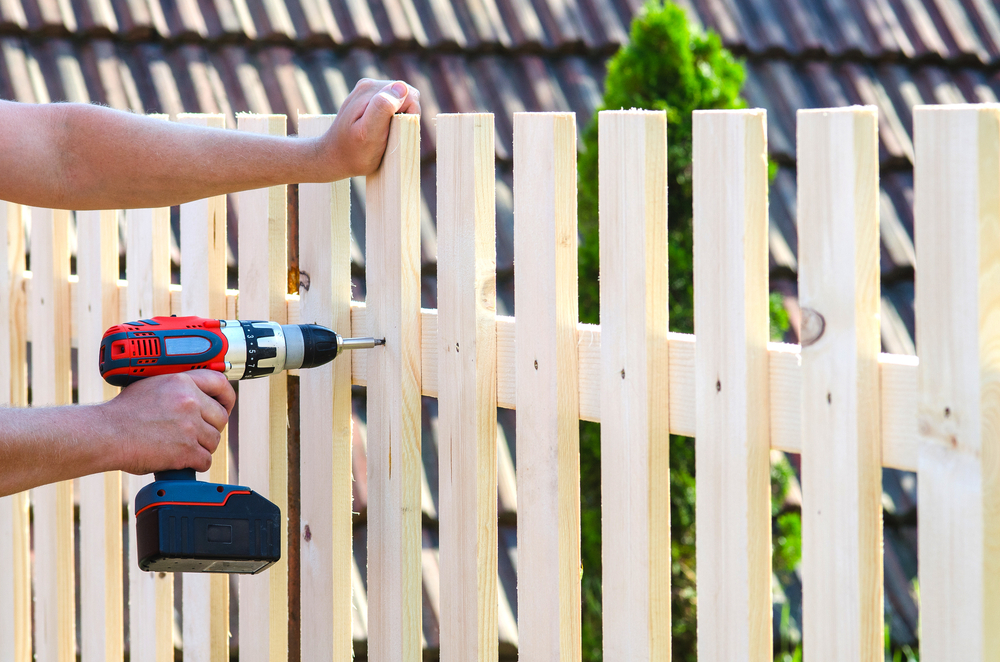 Man building fence