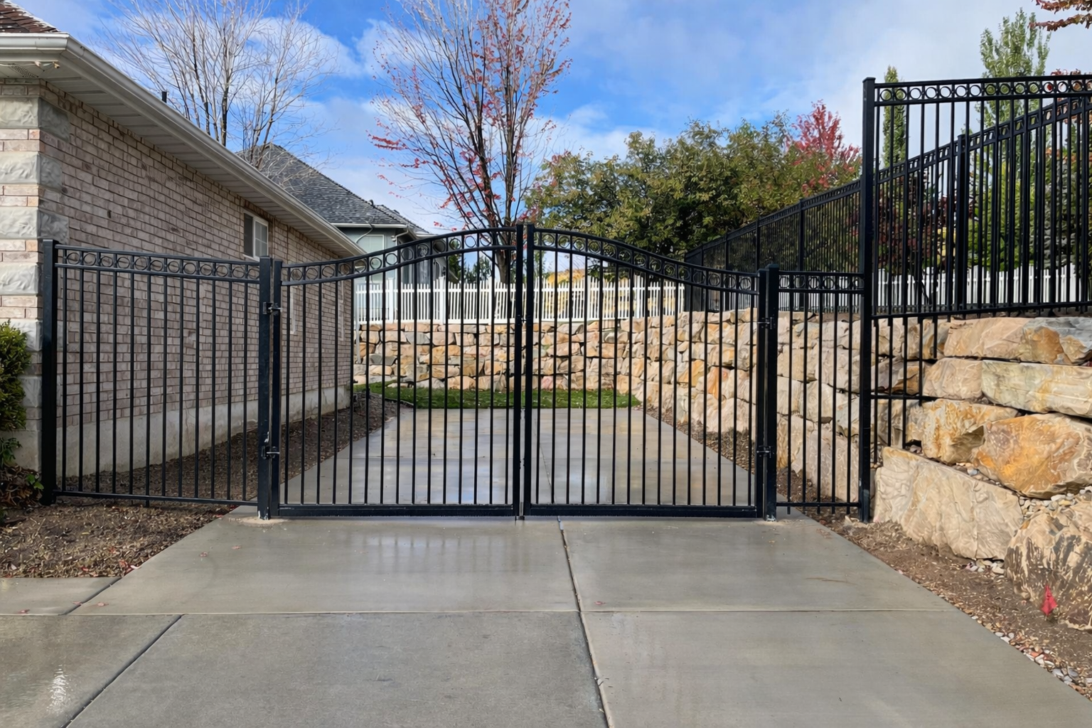 Wrought iron gates and stone walls